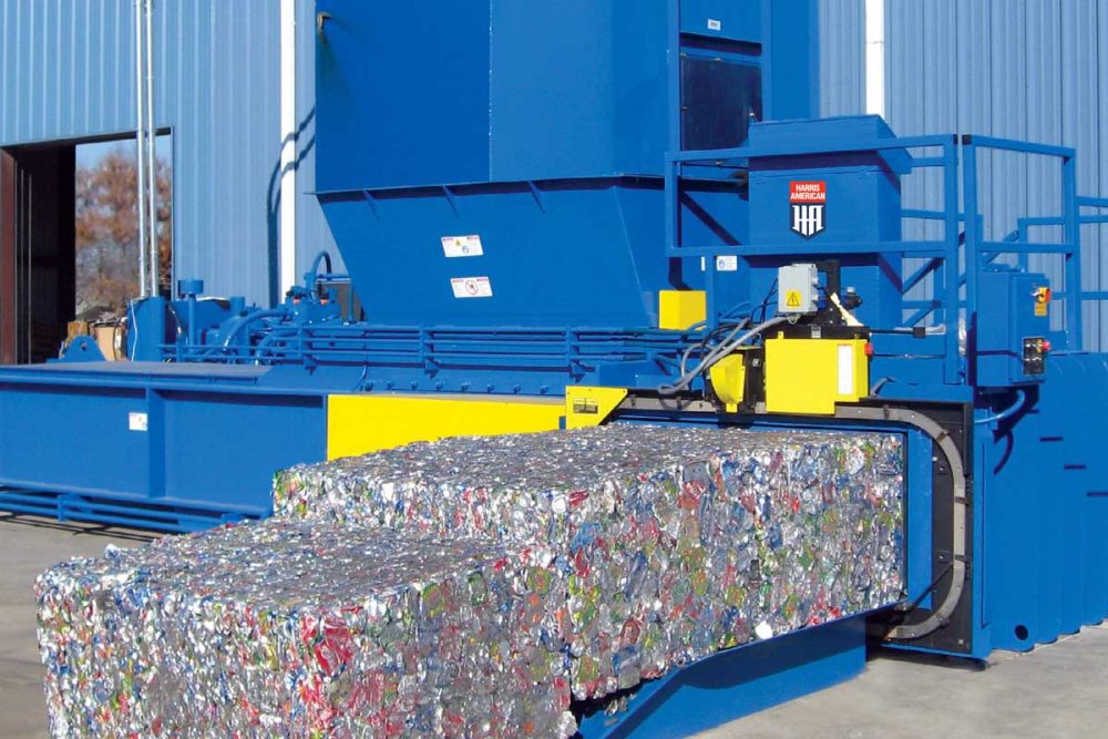 Blue And Yellow Harris American Co. Baler Making Bales Of Cans