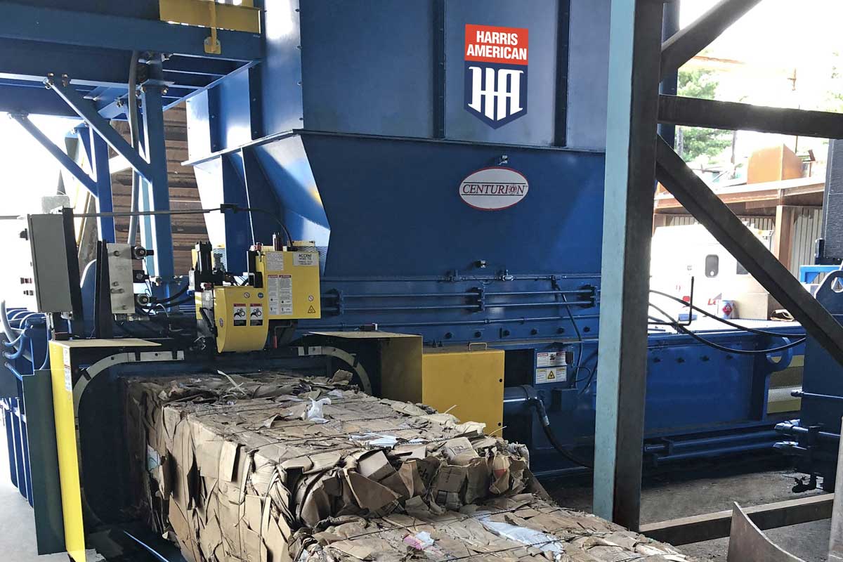 Blue And Yellow Harris American Co. Baler Machine Making Cardboard Paper Bales