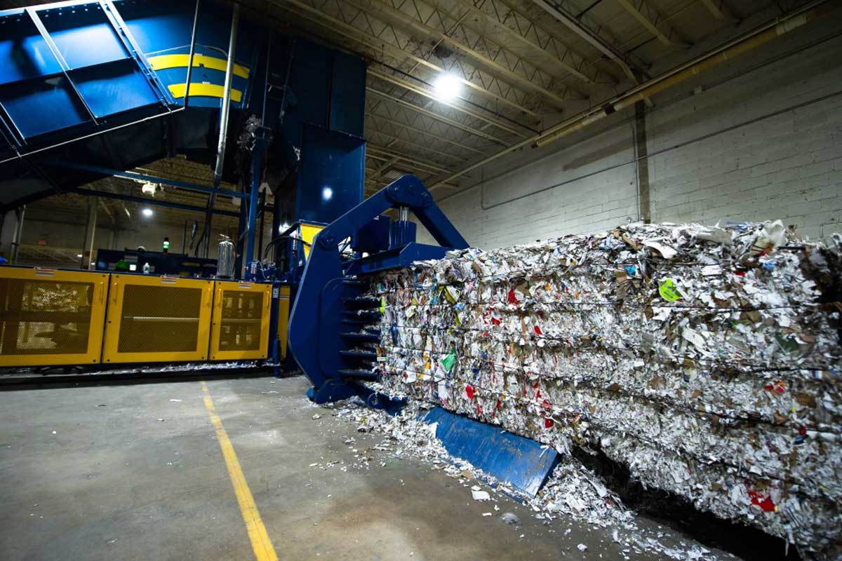 Harris American Co. Baler Making Bales Inside Of A Warehouse