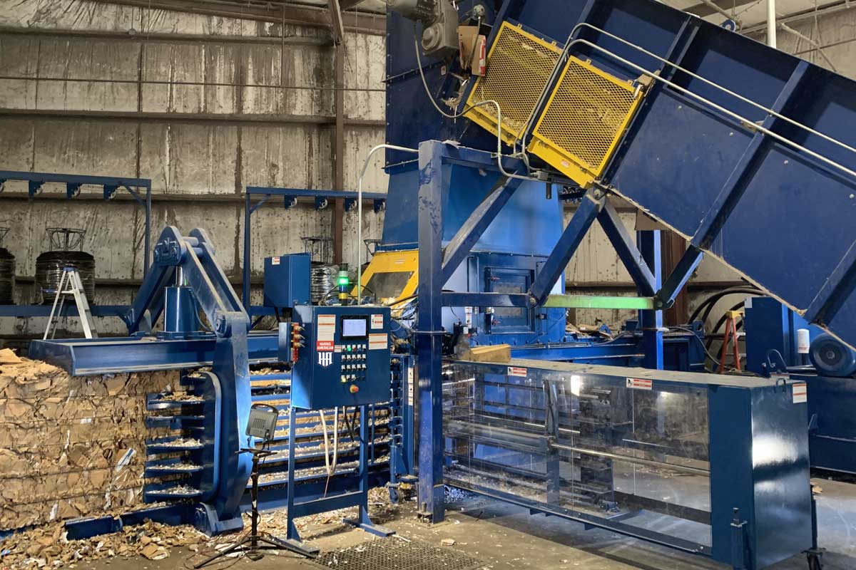 Harris American Co. Baler Making Bales Of Cardboard In A Factory