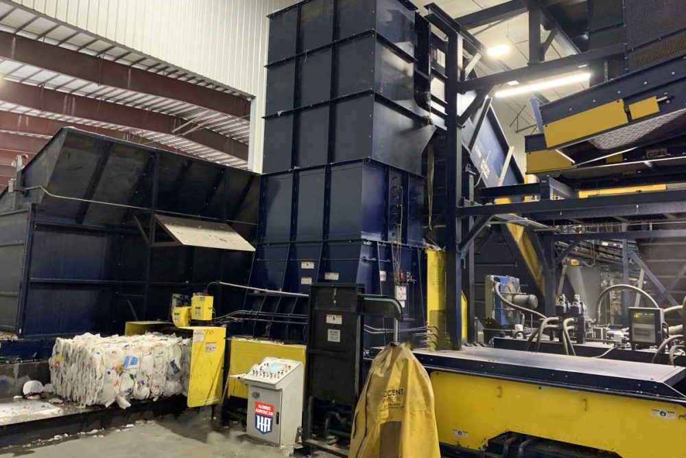 A Harris American Co. Baler Inside Of A Factory