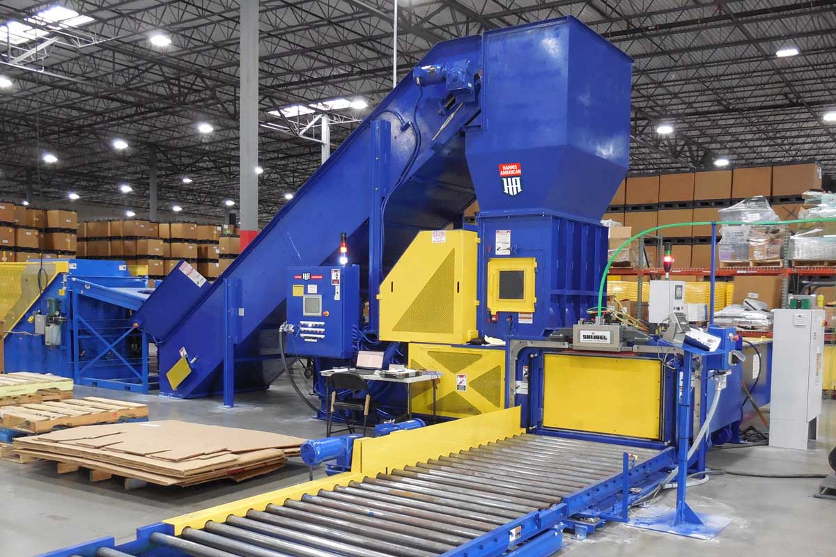 Harris American Co. Blue And Yellow Baler Indoors