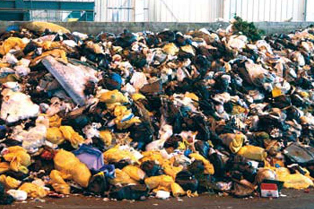 A Large Pile Of Garbage In A Warehouse.