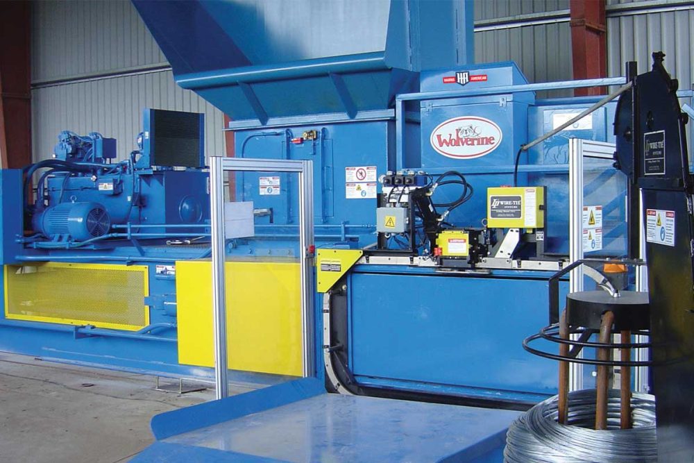 Harris American Co. Wolverine Two Ram Baler Indoors